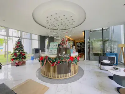 a christmas tree in the middle of a lobby at Kasara De Ulap BEST Staycation - 25th Floor City View - Pool & Fast Wi-Fi in Manila
