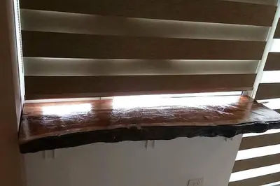 a window with a wooden blind on a wall at Breeze Residences with Ocean view by Bmars in Manila