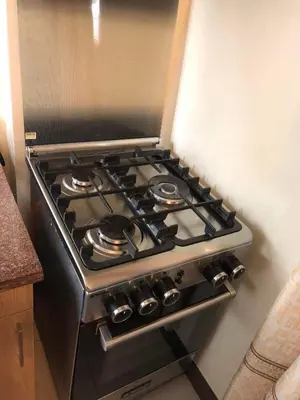 a stove top oven sitting in a kitchen at Two Bedroom Fully Furnished 70sqm CONDO MIREA RESIDENCES PASIG in Manila