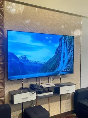 a large screen tv on a wall in a living room at 2BHK with Balcony Fully Furnished-70sqm Condo Pasig in Manila