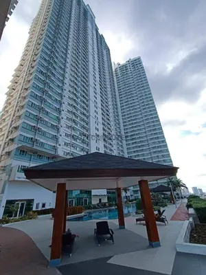 a large building with a gazebo in front of it at The Beacon Makati by Cozi Condotels in Manila