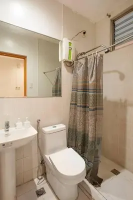 a bathroom with a toilet and a sink at JP Santiago Studio Makati J204 in Manila