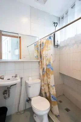 a bathroom with a toilet and a sink at JP Santiago Studio Makati J206 in Manila