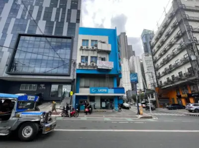 a truck driving down a street in a city at JP Santiago Studio Makati J304 in Manila