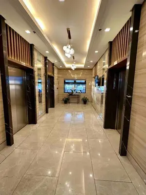 a hallway of a building with a large lobby at Staycation at Spring Residences in Paranaque in Manila