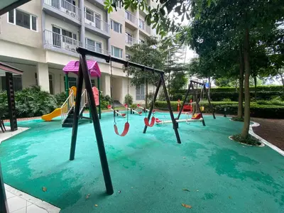 a playground in a pool of water with swings at Luxury Two Bedroom with Balcony in SOUTH RESIDENCE of Las Pinas in Manila