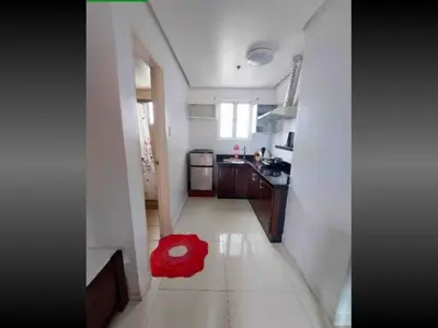 a red rug sitting on the floor of a kitchen at 40 Percent Promo Off This Month, Balcony Ocean View Plus Free Pool & Sauna Access Exclusive 2025 Rates at Walking Distance US Embassy, Front of Robinsons Place MANILA, Bellagio and Experience Breathtaking Manila Bay Views in Manila