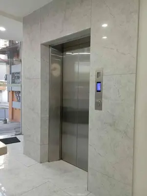 a elevator in a building with a sign on it at St. Marvin Studio Makati M204 in Manila