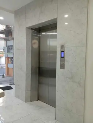 a elevator in a building with a sign on it at St. Marvin Studio Makati M202 in Manila