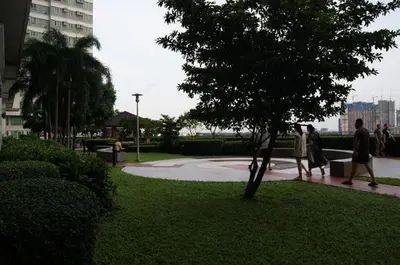 a group of people walking in a park at The Beacon Makati by mvmtransient in Manila