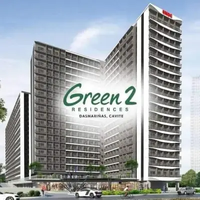 a large building with a green and white sign on it at HOMELY @ Green 2 Residences SMDC DLSUMC in Dasmariñas