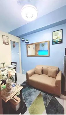 a living room with a couch and a table at FourSphere staycation in Manila