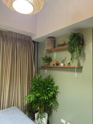 a bedroom with plants on shelves on the wall at Glamorous 3BR Suite in Uptown BGC w/Bathtub in Manila