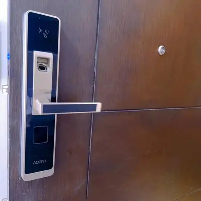 a pay phone is attached to a wooden door at -CONDO- Petite Residential Stay in Manila