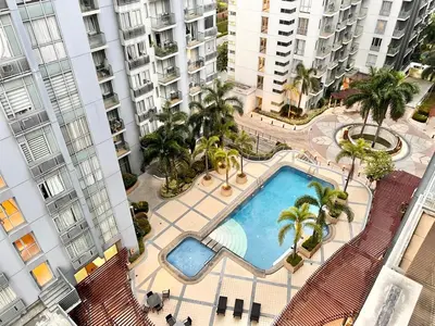 an overhead view of a swimming pool in the middle of a building at Elegant Condo Hotel across NAIA Airport Terminal 3 Newport City in Manila