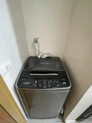 a toaster oven in the corner of a room at 8 Adriatico Staycation in Manila