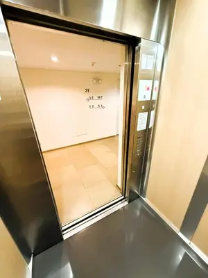an elevator door with a view of a room at JFam Suites, C3-3N Studio, Up To 4 Pax in Biñan