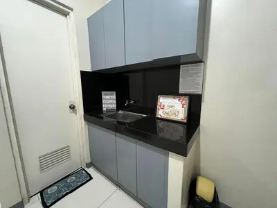 a small bathroom with a sink and a counter at P3K Suites Budget Hotel in Manila