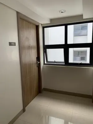 an empty room with a door and a window at SHORE 2 MOA Staycation T2 U1712 in Manila