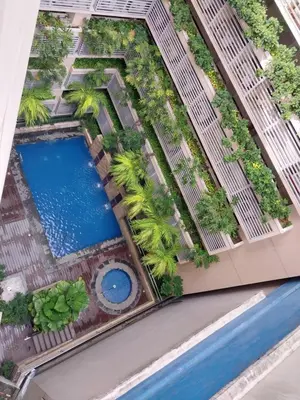 an overhead view of a pool at a resort at Alps Guesthouse at 150 Newport Blvd near T3 in Manila
