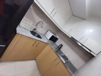 an overhead view of a kitchen with a sink at Caleze Properties Uptown Palazzo BGC One Bedroom in Manila