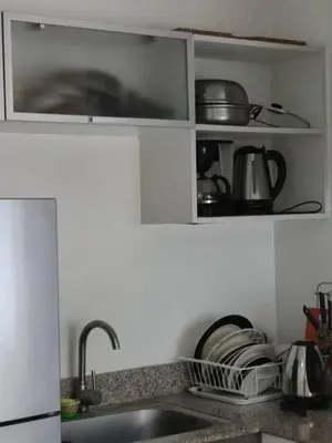 a kitchen with a sink and a counter top at Need Place To Stay Booked Now Manila with Balcony Sea View, Promo Discount, Free Pool Plus Free Sauna Access Steps Away US Embassy, Updated 2026 Prices - Hurry Limited Time Only in Manila