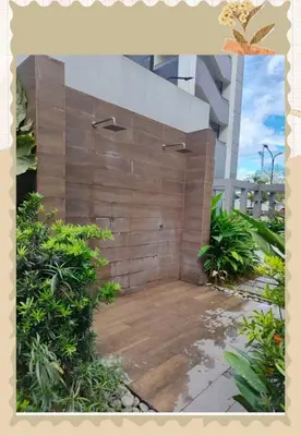 a wooden retaining wall in front of a building at Avery's Place SMDC CHARM in Manila