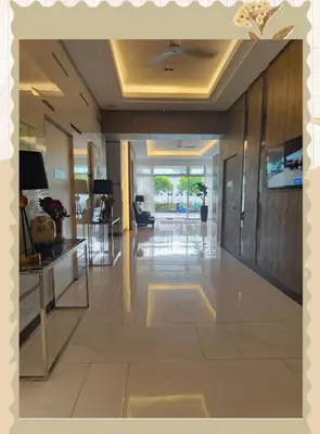 a large hallway with a lobby with a reception desk at Avery's Place SMDC CHARM in Manila