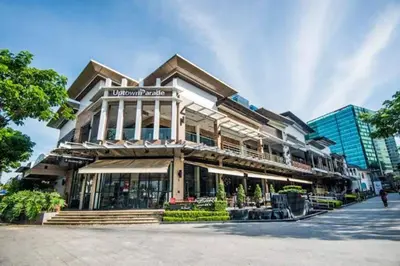 a building on a street in a city at LUXESTAYSMNL ELEGANT FAMILY 2BR SUITE POOLGYM 400MBPS WIFI NETFLX AMAZING CITY VIEW in Manila