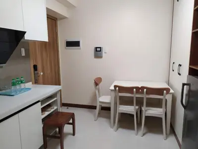 a kitchen with a table and chairs in a room at Beachfront U.S. Embassy Family Retreat. in Manila