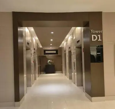 a hallway of a building with a tower dl sign at NAIA Airport 956 DYNASTEL SHORE Staycation in Manila