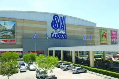 a swm suv dealership with cars parked in a parking lot at Near Manila Airport, MAILZ HOMEZ COZY Hotel Style Studio Condo, Avida Towers Sucat, Full Kitchen, Swimming Pool, WIFI, 5G in Manila