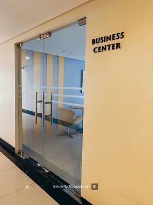 an office door with a business center sign on it at Perfect for Working, Quiet & Relaxing at Uptown BGC in Manila