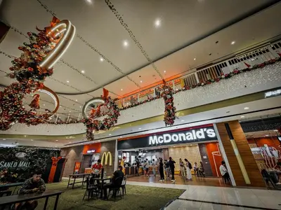 a shopping mall with a christmas tree hanging from the ceiling at Sunny Spot in Manila