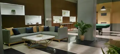 a living room with a couch and a table at The Radiance Manila Bay Studio 2 in Manila