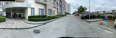 an empty street in front of a building at Hotel Luxury Twin Bed Room with Balcony Las Pinas-South Residence in Manila