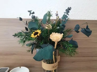 a vase filled with flowers on a table at romantic makati in Manila