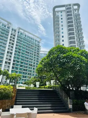 a set of stairs in front of two tall buildings at Azure Urban Resort - St Tropez Tower Staycation Unit with a European Touch in Manila