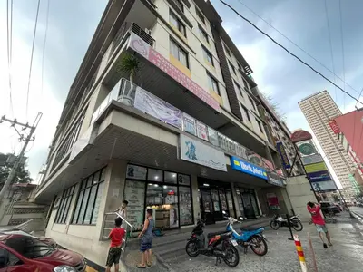 a group of people standing in front of a building at Eco Friendly Studio Rooms Edsa Mandaluyong Shaw at F Residences under New Management in Manila