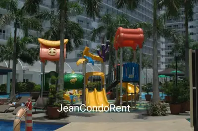 a playground in a resort with a slide at Magayon Staycation Shell Residences Mall of Asia in Manila