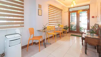 a dining room with a table and chairs at Catlea Inn in Manila