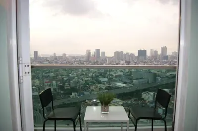 a room with a view of a city at The Beacon Makati by mvmtransient in Manila