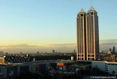 a view of a city with a tall building at Twin Beds Studio Room with City View in Manila