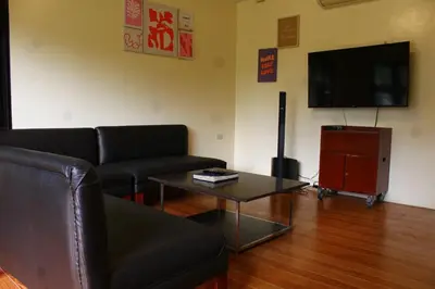 a living room with a couch and a coffee table at MaClare Resort in Imus