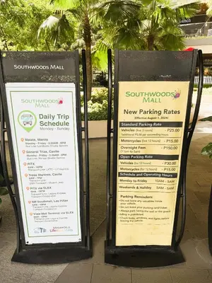 two signs sitting on a sidewalk next to a sidx sidx sidx at JFam Suites, C3-11D Studio, Up To 4 Pax in Biñan