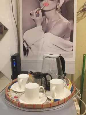 a tray with a tea pot and cups on a table at Arcobaleno in Manila
