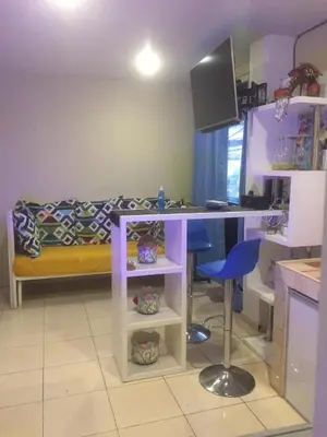 a small room with a desk and a bed at Arcobaleno in Manila