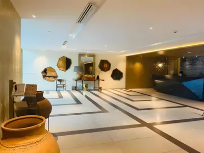 a room with vases and paintings on the walls at DFT Apartment 