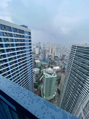 a view of a city from the top of a building at Cozy Family Nook at Makati in Manila