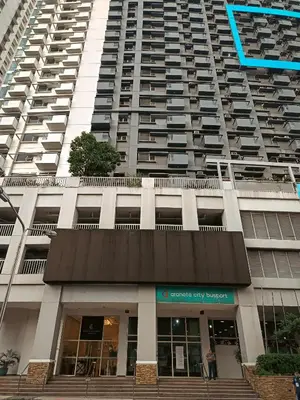 a large apartment building with a large building at The Bat Cave 2 at Manhattan Heights Araneta Cubao in Manila